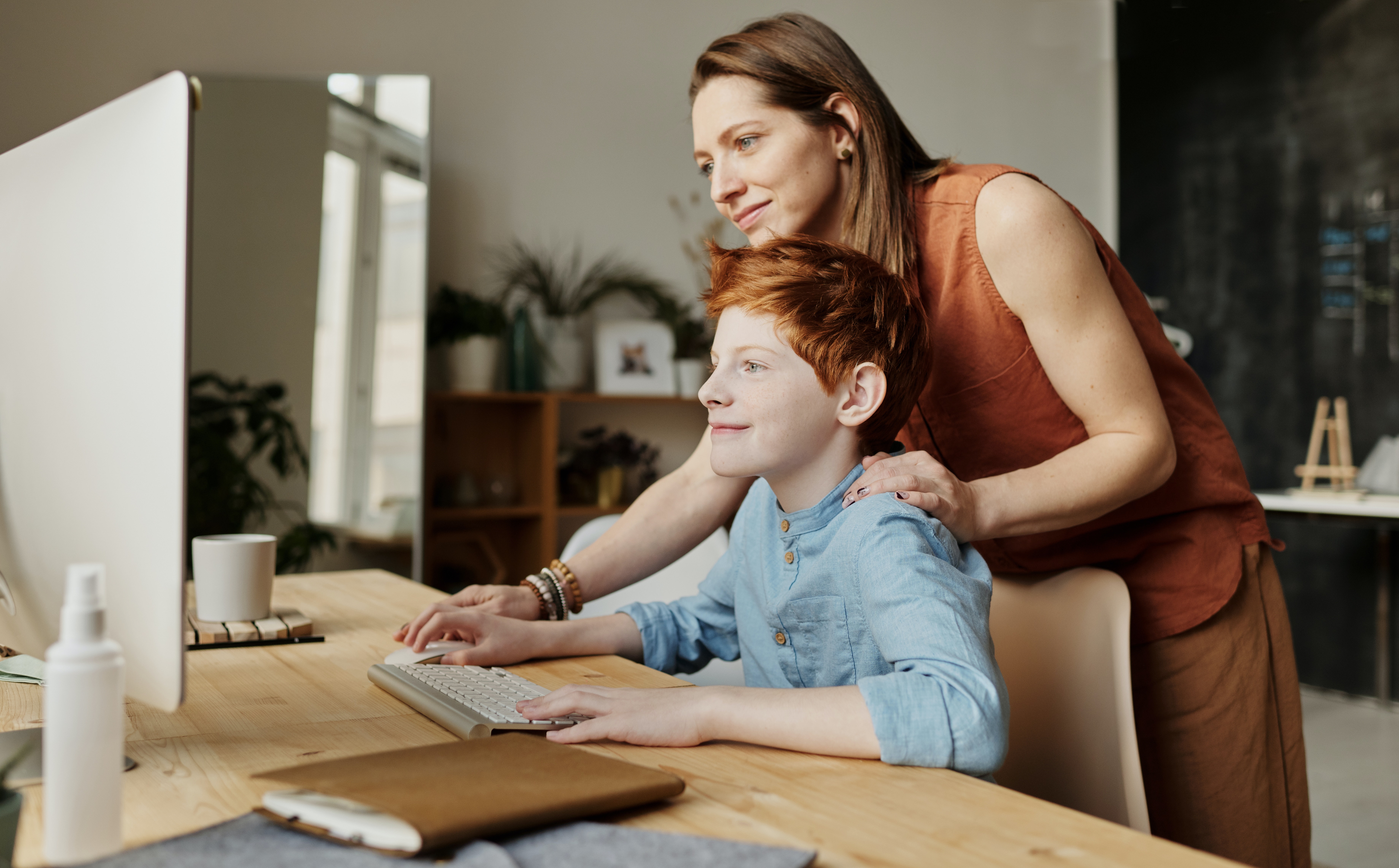Boy typing at home